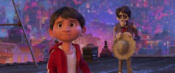 Movie still from “Coco” (2017), directed by Adrian Molina – A couple of kids that are next to each other; Medium shot, Over the shoulder angle