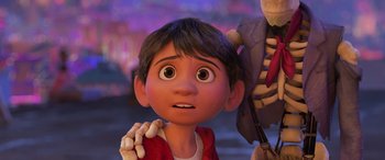 Movie still from “Coco” (2017), directed by Adrian Molina – A young boy is looking up at a skeleton; Close Up shot, Over the shoulder angle