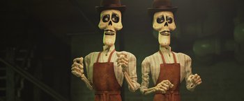 Movie still from “Coco” (2017), directed by Adrian Molina – A couple of skeletons wearing aprons and hats; Medium shot, Low angle