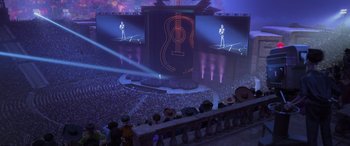 Movie still from “Coco” (2017), directed by Adrian Molina – A crowd of people standing in front of a stage; Extreme Wide shot, High angle