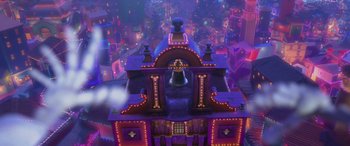 Movie still from “Coco” (2017), directed by Adrian Molina – An overhead view of a building with a bell on top of it; Extreme Wide shot, Overhead angle