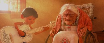 Movie still from “Coco” (2017), directed by Adrian Molina – An old woman sitting in a chair next to a young boy; Close Up shot, Over the shoulder angle