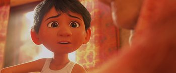 Movie still from “Coco” (2017), directed by Adrian Molina – A young boy's eyes and mouth; Close Up shot, Over the shoulder angle