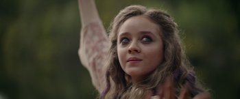 Movie still from “Color Out of Space” (2019), directed by Richard Stanley – A young girl looking up into the sky; Close Up shot, Low angle