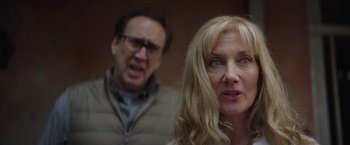 Movie still from “Color Out of Space” (2019), directed by Richard Stanley – A man and a woman standing next to each other; Close Up shot, Over the shoulder angle