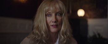 Movie still from “Color Out of Space” (2019), directed by Richard Stanley – A person with long blonde hair; Close Up shot, Low angle