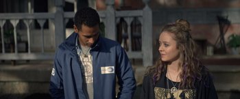 Movie still from “Color Out of Space” (2019), directed by Richard Stanley – A man and a woman standing next to each other; Close Up shot, Over the shoulder angle