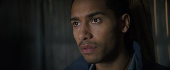 Movie still from “Color Out of Space” (2019), directed by Richard Stanley – A man's face in a dark room; Close Up shot, Over the shoulder angle