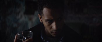 Movie still from “Color Out of Space” (2019), directed by Richard Stanley – A person holding a cell phone; Close Up shot, Over the shoulder angle