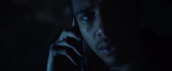 Movie still from “Color Out of Space” (2019), directed by Richard Stanley – A person talking on a cell phone; Close Up shot, Low angle