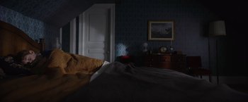 Movie still from “Color Out of Space” (2019), directed by Richard Stanley – A bed room with a bed and a dresser in it; Wide shot, High angle