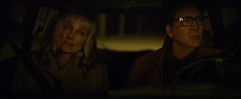 Movie still from “Color Out of Space” (2019), directed by Richard Stanley – A woman and a man sitting in the back of a car; Close Up shot, Over the shoulder angle