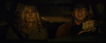 Movie still from “Color Out of Space” (2019), directed by Richard Stanley – A man and a woman sitting in the back of a car; Close Up shot, Over the shoulder angle