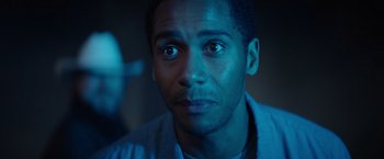Movie still from “Color Out of Space” (2019), directed by Richard Stanley – A person looking at the camera; Close Up shot, Low angle