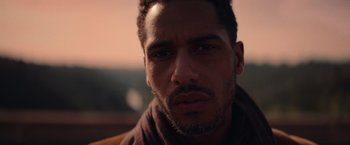 Movie still from “Color Out of Space” (2019), directed by Richard Stanley – A man's face in a brown shirt; Close Up shot, Low angle