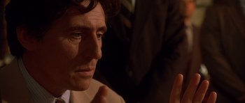 Movie still from “The Usual Suspects” (1995), directed by Bryan Singer – A person looking at something; Close Up shot, Over the shoulder angle