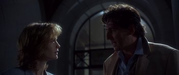 Movie still from “The Usual Suspects” (1995), directed by Bryan Singer – A man and a woman talking to each other; Close Up shot, Low angle