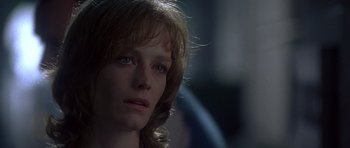 Movie still from “The Usual Suspects” (1995), directed by Bryan Singer – A person with long blonde hair; Close Up shot, Low angle
