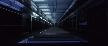 Movie still from “The Usual Suspects” (1995), directed by Bryan Singer – An empty parking lot with a lot of shelves; Extreme Wide shot, Low angle