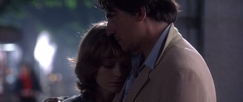 Movie still from “The Usual Suspects” (1995), directed by Bryan Singer – A man and a woman embracing each other in the dark; Close Up shot, Low angle