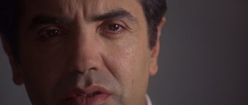 Movie still from “The Usual Suspects” (1995), directed by Bryan Singer – A man's face with a lot of wrinkles on his face; Extreme Close Up shot, Low angle