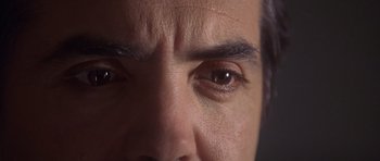 Movie still from “The Usual Suspects” (1995), directed by Bryan Singer – A man's eyes and his eyebrows; Extreme Close Up shot, Overhead angle