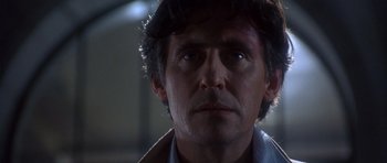 Movie still from “The Usual Suspects” (1995), directed by Bryan Singer – A person wearing a jacket; Close Up shot, Low angle