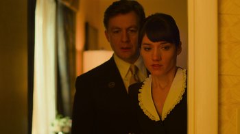 Movie still from “Contagion” (2011), directed by Steven Soderbergh – A man and a woman standing next to each other; Close Up shot, Low angle