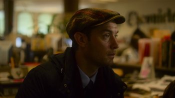 Movie still from “Contagion” (2011), directed by Steven Soderbergh – A person wearing a hat; Close Up shot, Over the shoulder angle