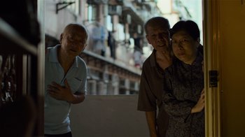 Movie still from “Contagion” (2011), directed by Steven Soderbergh – A group of people standing next to each other; Medium shot, High angle