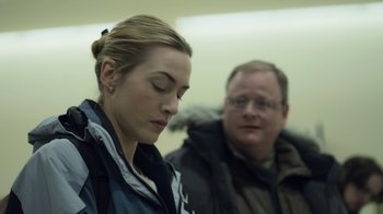Movie still from “Contagion” (2011), directed by Steven Soderbergh – A man and a woman sitting next to each other; Close Up shot, Over the shoulder angle