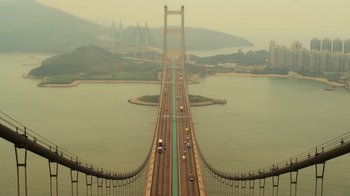 Movie still from “Contagion” (2011), directed by Steven Soderbergh – An aerial view of a bridge with cars on it; Extreme Wide shot, High angle