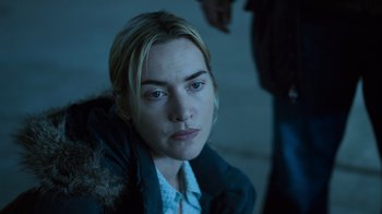 Movie still from “Contagion” (2011), directed by Steven Soderbergh – A person wearing a jacket; Close Up shot, High angle