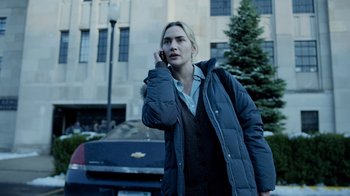 Movie still from “Contagion” (2011), directed by Steven Soderbergh – A woman is talking on a cell phone outside; Medium shot, Over the shoulder angle