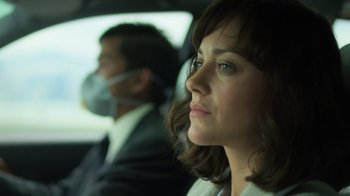 Movie still from “Contagion” (2011), directed by Steven Soderbergh – A woman sitting next to a man in a car; Close Up shot, Low angle