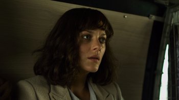 Movie still from “Contagion” (2011), directed by Steven Soderbergh – A person wearing a jacket; Close Up shot, Low angle