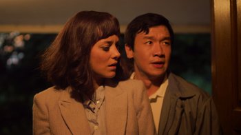 Movie still from “Contagion” (2011), directed by Steven Soderbergh – A man and a woman standing next to each other; Close Up shot, Over the shoulder angle