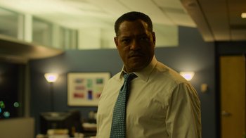 Movie still from “Contagion” (2011), directed by Steven Soderbergh – A man wearing a white dress shirt and a blue tie; Medium shot, Low angle