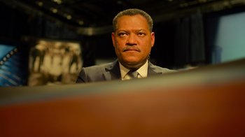 Movie still from “Contagion” (2011), directed by Steven Soderbergh – A man in a suit and tie; Close Up shot, Low angle