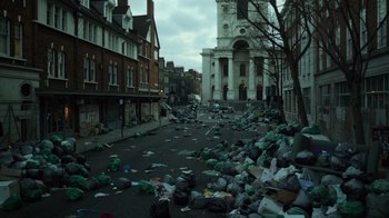 Movie still from “Contagion” (2011), directed by Steven Soderbergh – A city street filled with trash and garbage; Extreme Wide shot, High angle