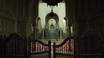 Movie still from “Contagion” (2011), directed by Steven Soderbergh – An open gate in a large room with a chandelier; Extreme Wide shot, Low angle