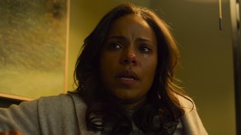 Movie still from “Contagion” (2011), directed by Steven Soderbergh – A person with long brown hair; Close Up shot, Low angle