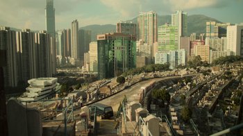 Movie still from “Contagion” (2011), directed by Steven Soderbergh – An aerial view of a city with a train on the tracks; Extreme Wide shot, High angle