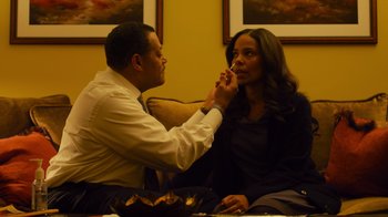 Movie still from “Contagion” (2011), directed by Steven Soderbergh – A man and a woman sitting at a table; Medium shot, High angle