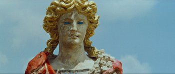 Movie still from “Contempt” (1963), directed by Jean-Luc Godard – A statue of a woman with blue eyes; Close Up shot, Low angle
