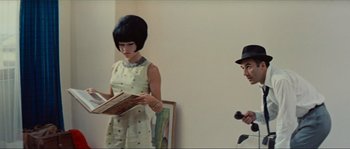 Movie still from “Contempt” (1963), directed by Jean-Luc Godard – A man and a woman are standing in a room; Medium shot, Over the shoulder angle