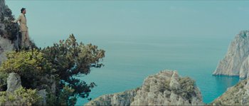 Movie still from “Contempt” (1963), directed by Jean-Luc Godard – A view of a body of water from a cliff; Extreme Wide shot, Low angle