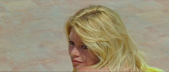 Movie still from “Contempt” (1963), directed by Jean-Luc Godard – A woman with blonde hair is looking to her left; Close Up shot, High angle