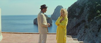 Movie still from “Contempt” (1963), directed by Jean-Luc Godard – A man and a woman standing next to each other; Medium shot, Low angle