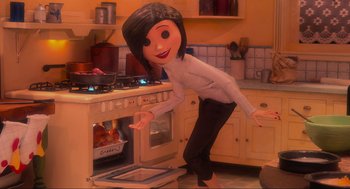 Movie still from “Coraline” (2009), directed by Henry Selick – A woman is standing in front of an oven; Medium shot, Over the shoulder angle
